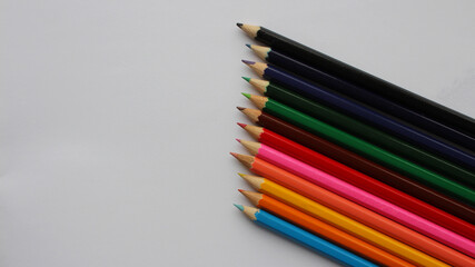Naklejka premium Wooden colored pencils isolated on white background. Creation. Place for text.