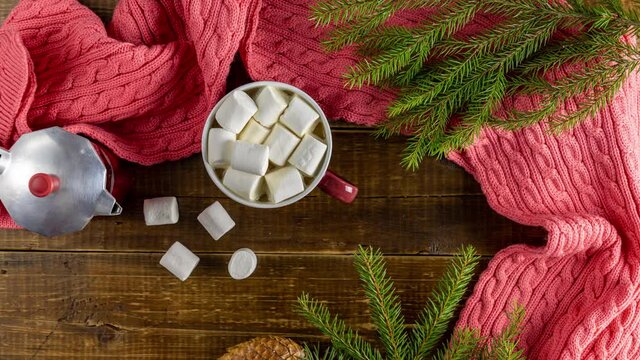 Christmas holiday composition of coffee with marshmallows on dark wood background table. Stop Motion animation.