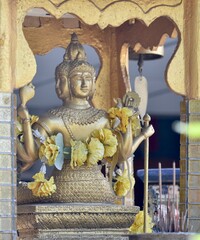 Beautiful golden Buddha statue on a shrine