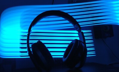 Fototapeta na wymiar headphones on blue background