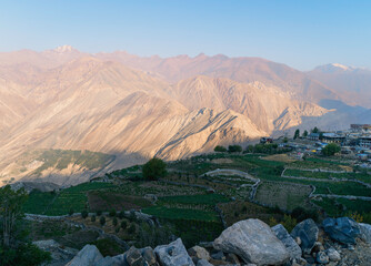 Elevated view of agricultural fields with Himalayas in background in Nako, India. - Powered by Adobe