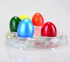 Red, green,yellow,blue,green painted easter eggs shot together.