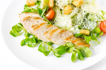 Caesar salad on a white dish