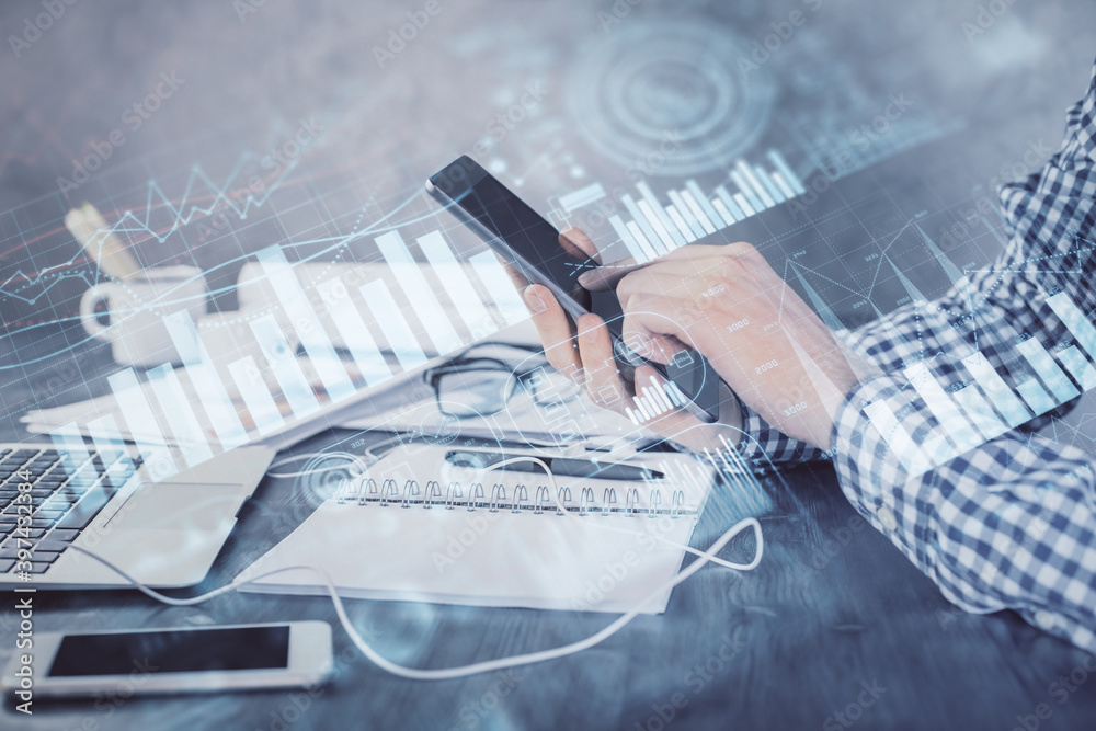 Poster double exposure of man's hands holding and using a digital device and forex graph drawing. financial