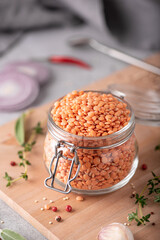 dry red lentils with spices in a glass jar