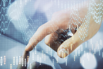 Multi exposure of man's hands holding and using a phone and financial chart drawing. Market analysis concept.