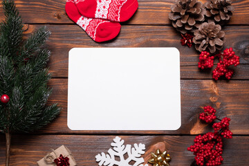 Christmas card composition. Gifts, fir tree branches, red decorations. Christmas, winter, new year concept. Flat lay, top view, copy space.