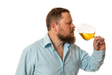 Fototapeta premium Solid bearded man in shirt tasting whisky studio portrait