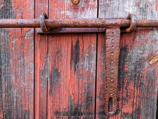 old antique door with a metal latch