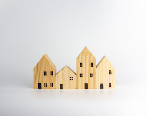 Simulated wooden house on white background Housing business ideas