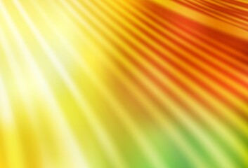 Light Red, Yellow vector blurred shine abstract background.