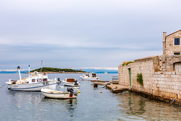 Fototapeta na wymiar View of the gulf with motor boats near the island of Vis, Croatia