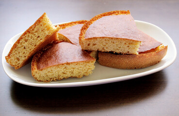 Corn bread slice in the plate, top view
