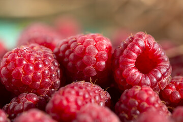 Red ripe raspberries close-up.Healthy vitamin foods. The concept of the berries to treat colds