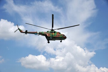 Fototapeta na wymiar Russian military helicopter MI-8 in the sky