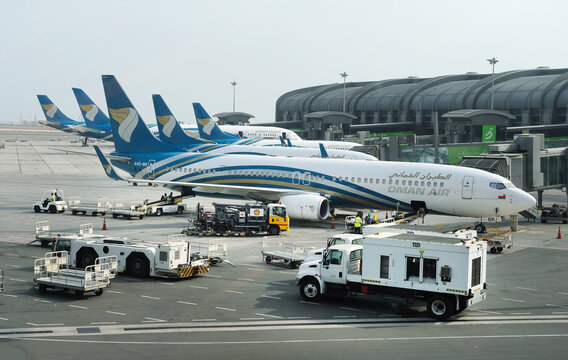 Muscat, Oman, picture dated  August 28, 2019: Muscat new airport with Oman air planes. Oman air. BOEING 737-900ER. 

