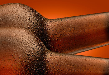 Two bottles of steamed beer, the necks with drops close-up. A symbol of thirst and pleasure, they...