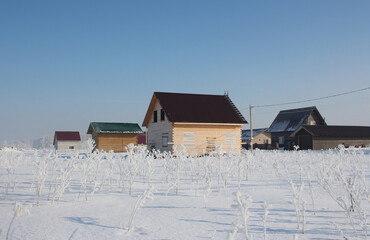 winter in Siberia village in snowdrifts in the North of the house froze