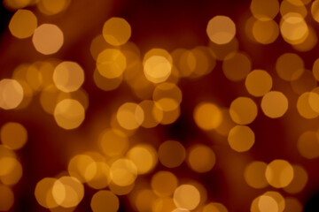 Beautiful defocused old golden lights bokeh on an abstract background. Christmas and New Year holidays template