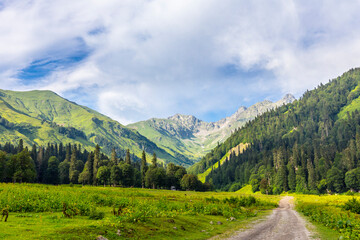 Fototapeta na wymiar Scenery mountain landscape at Caucasus mountains with road track