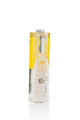 Oxidized  alkaline battery close up on white background