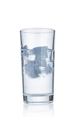 Water glass with ice cubes isolated on white background