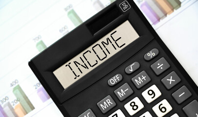 INCOME word on calculator. Business and financial concept