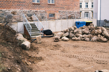 on building site lies a big pile of field stones