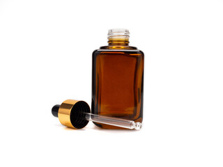 Brown medicine glass bottle with dropper isolated on white background is used for cosmetic skin care product ,containing products and medical supplies.clipping path