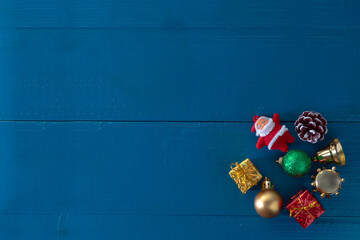 Flat lay view of Christmas decoration over blue wooden vintage table with copy space