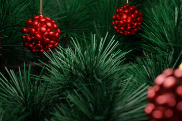 3D illustration green coniferous trees with red balls  in the form of coronavirus. Christmas card with an empty field for filling and a Christmas tree in a natural style