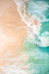 View from above, stunning aerial view of an unidentified person walking on a beautiful beach bathed by a turquoise sea. Kelingking beach, Nusa Penida, Indonesia. © Travel Wild