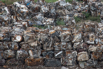Cars that have been scrapped are crushed into cubes for disposal