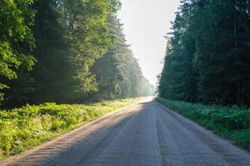 endless beautiful country gravel road in perspective