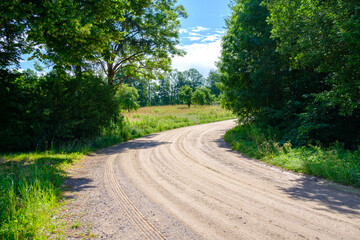 endless beautiful country gravel road in perspective