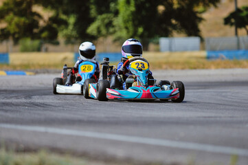 Young go cart racer on circuit - obrazy, fototapety, plakaty