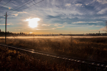 Fototapeta na wymiar an old railroad at sunrise