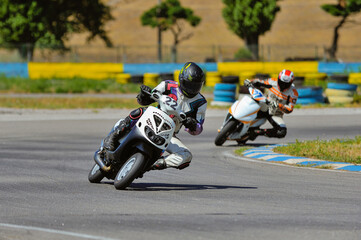 Motorcycle practice leaning into a fast corner on track