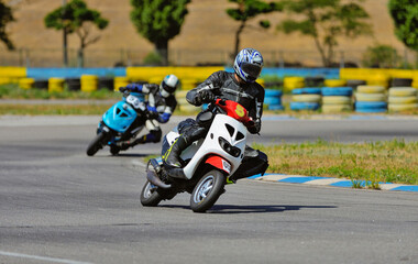 Motorcycle practice leaning into a fast corner on track