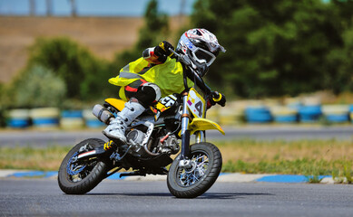 Motorcycle practice leaning into a fast corner on track