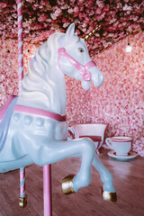 Children's carousel horse on a pink background © asauriet