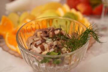 Green salad with mushrooms in a beautiful plate