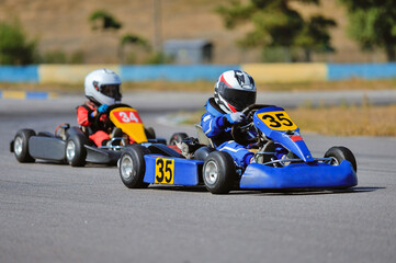 Young go cart racer on circuit