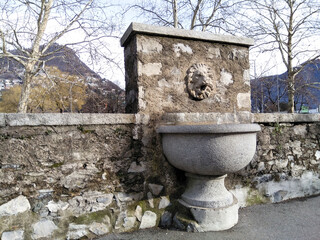 Ancient fountain with lion head