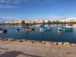 Fototapeta na wymiar Boats in the Oued Bouregreg separating Rabat and Salé,