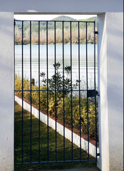 Photograph of a gate with a view of a panorama