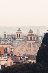 Fototapeta na wymiar Different colors of the domes of Santa Maria dei Miracoli and of Santa Maria in Montesanto, Rome Piazza del Popolo.