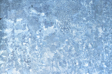 Frozen drops of condensation on a window, a sharp drop in temperature, sharply frozen drops of water on glass in winter, extremely cold low air temperatures