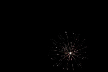Single white firework isolated on black, bright colorful, copy space.