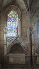 stained glass windows in the limit with tombs of kings in an ancient  monastery